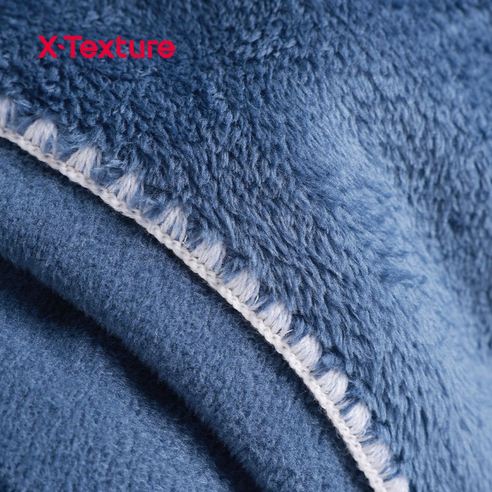 Close-up of slate blue double side fleece fabric with a soft flannel-touch surface.