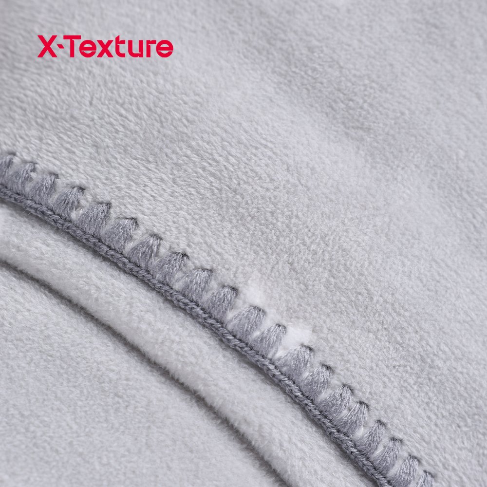 Close-up of grey star print double side fleece fabric with a soft flannel-touch surface.
