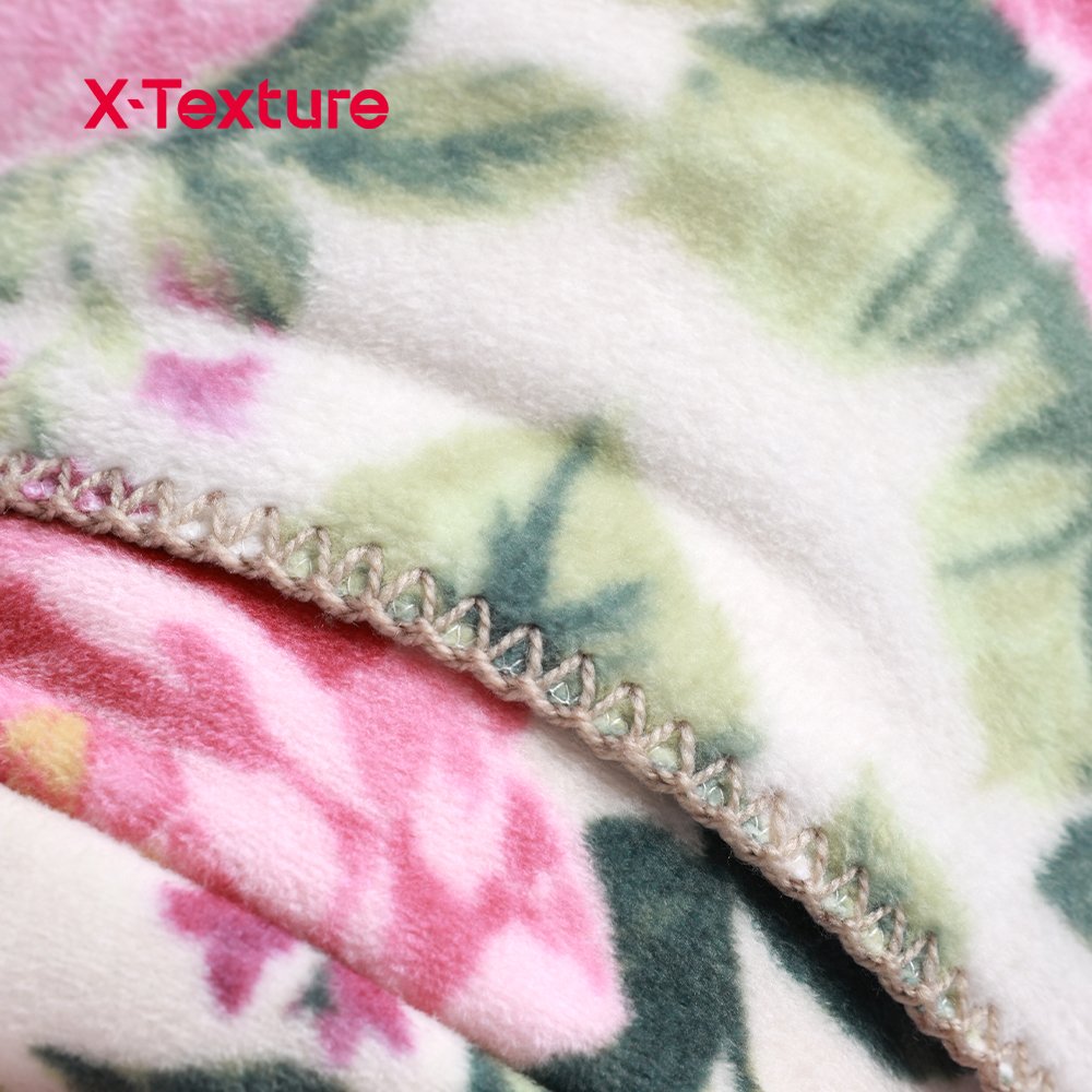 Close-up of floral print double side fleece fabric with a soft flannel-touch surface.