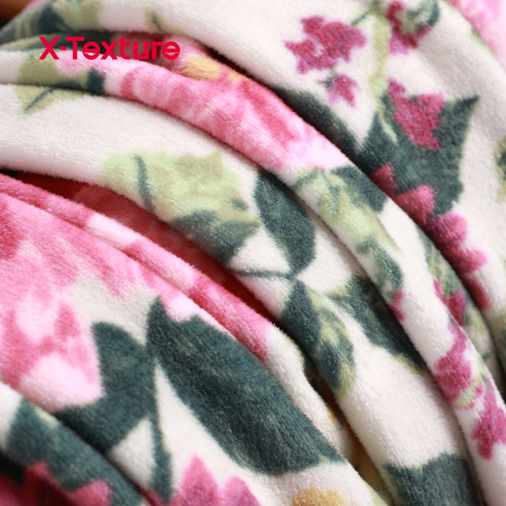 Floral print double side fleece fabric showing the smooth printed face and fluffy reverse texture.