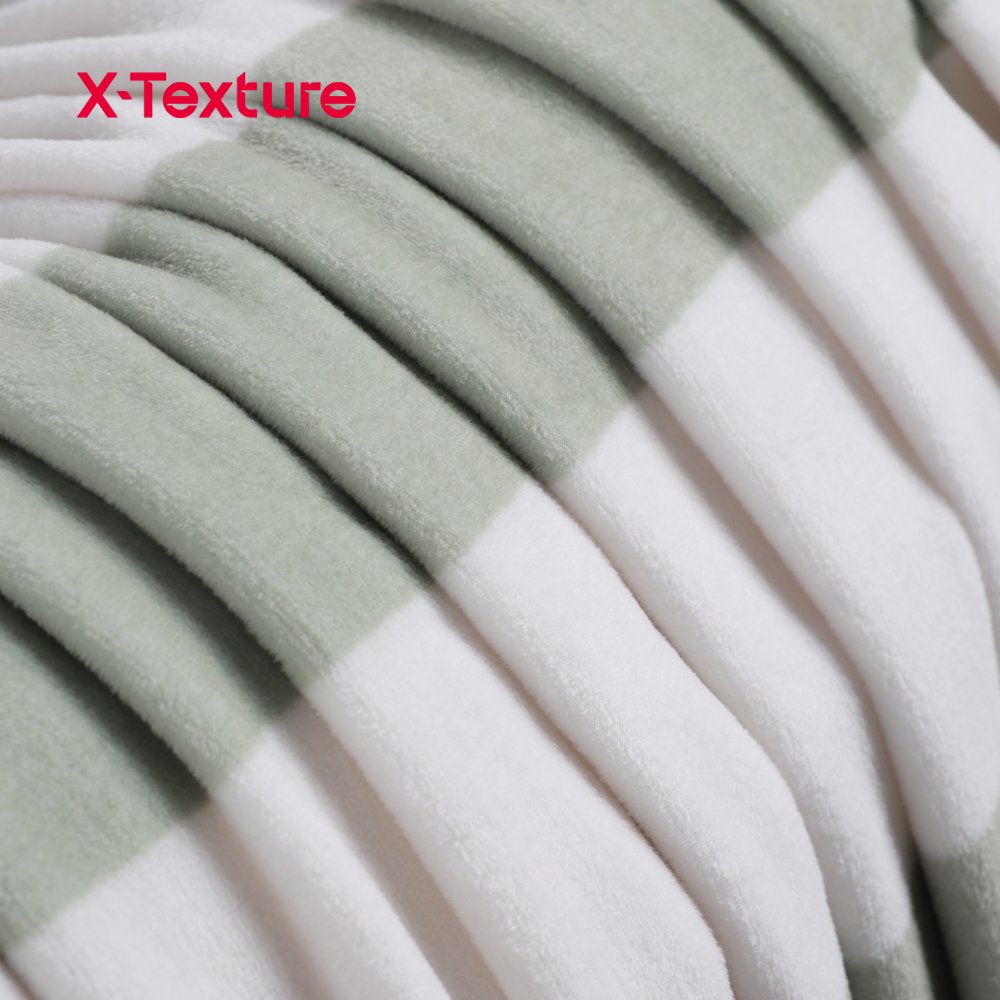 Sage green plaid print double side fleece fabric showing the smooth face and fluffy reverse texture.