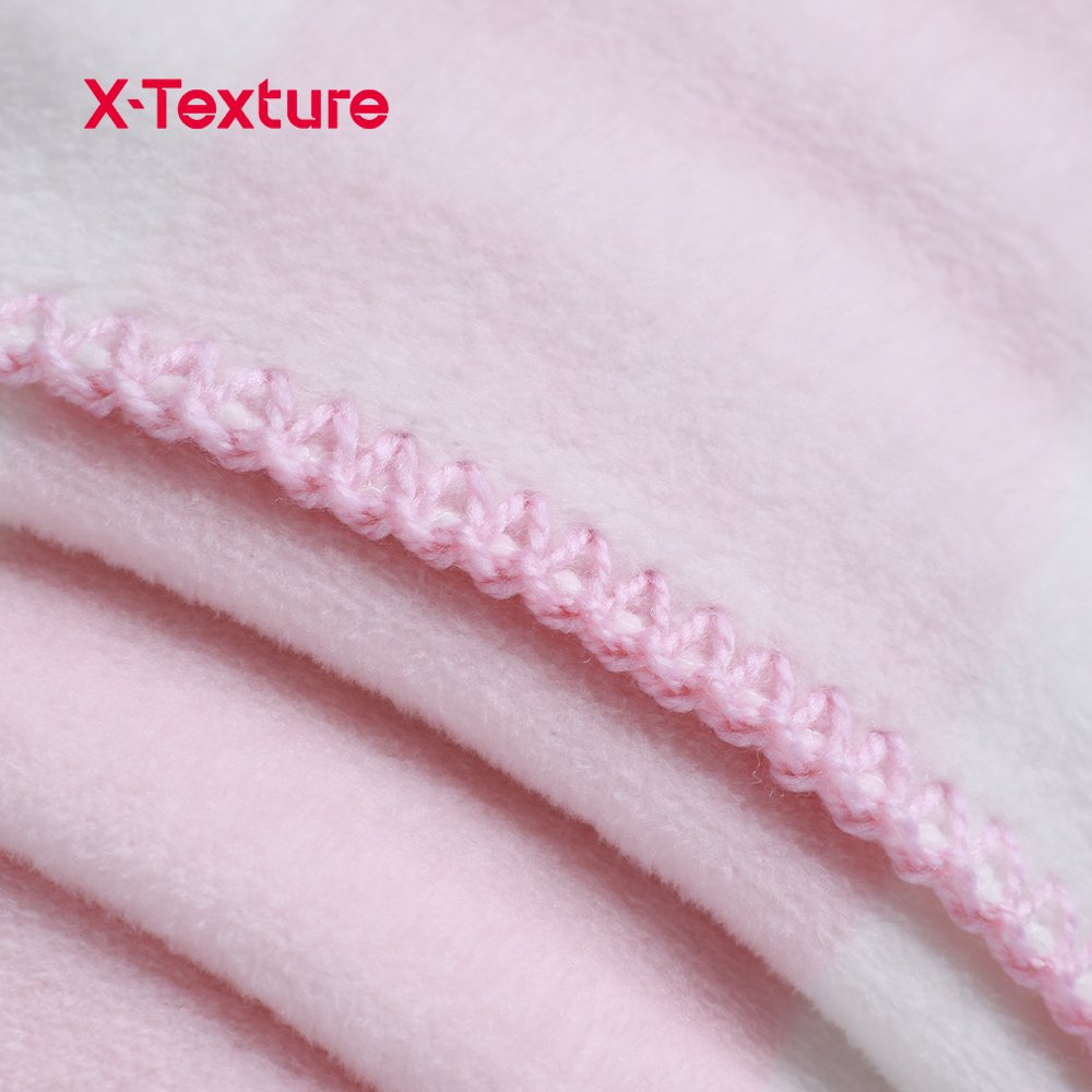 Close-up of pink plaid print double side fleece fabric with a soft flannel-touch surface.
