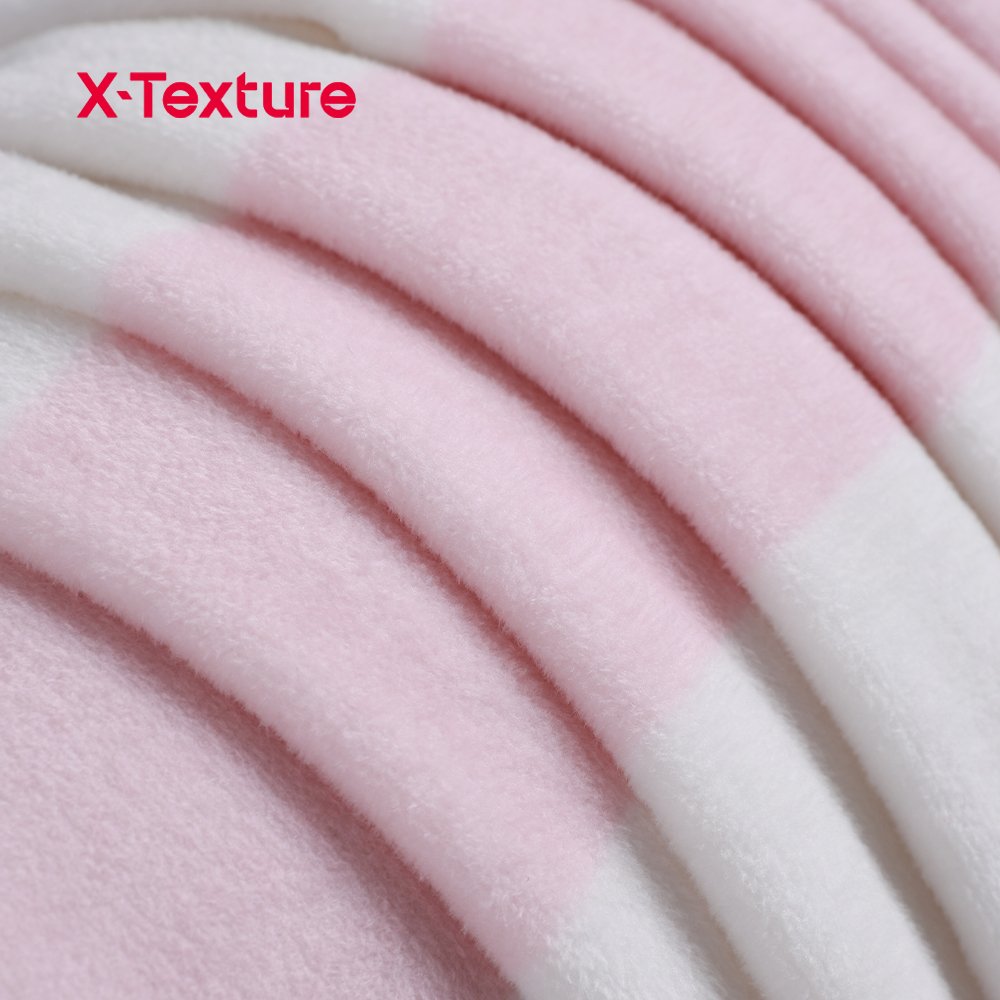 Pink plaid print double side fleece fabric showing the smooth face and fluffy reverse texture.